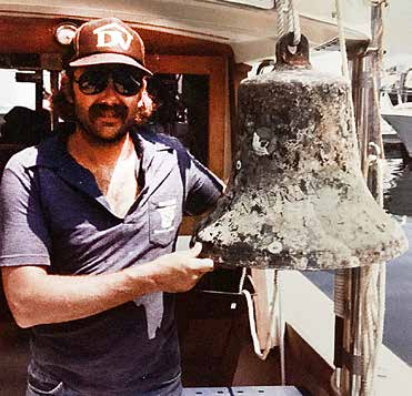 John Moyer with a recovered ship bell